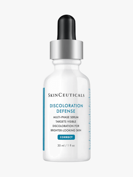 Discoloration Defense in white bottle with silver and black pipette on light gray background